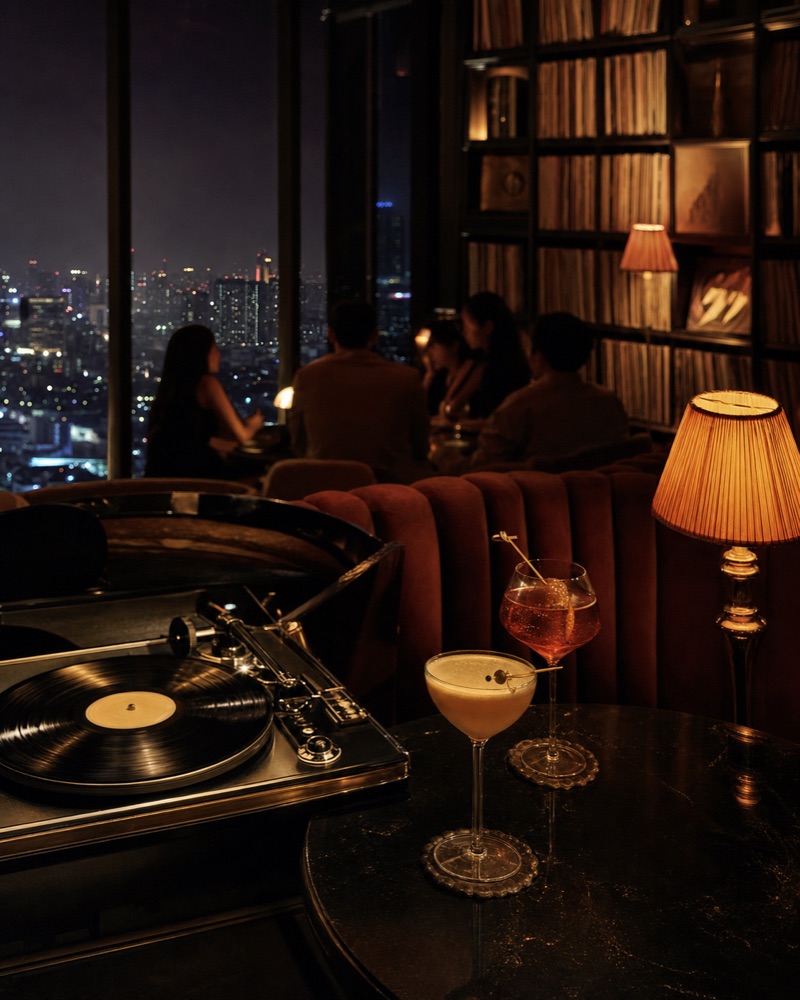 A vinyl turntable and cocktails in a velvet speakeasy with city views